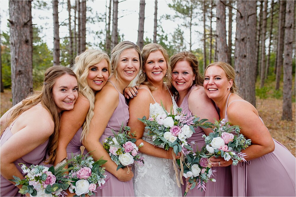 bridesmaids-woods-pink-dresses-flowers.jpg