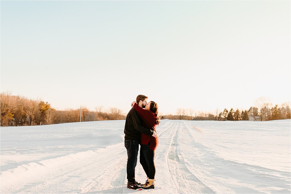 couple-kissing-snow-sun.jpg