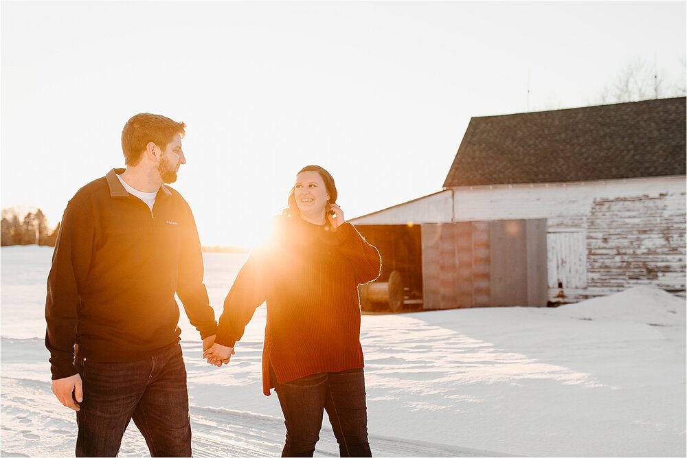 couple-walking-sun-flare-snow.jpg