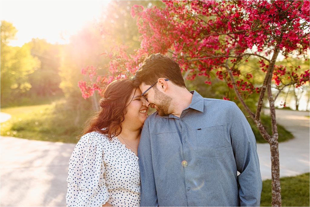 couple with foreheads together sunset