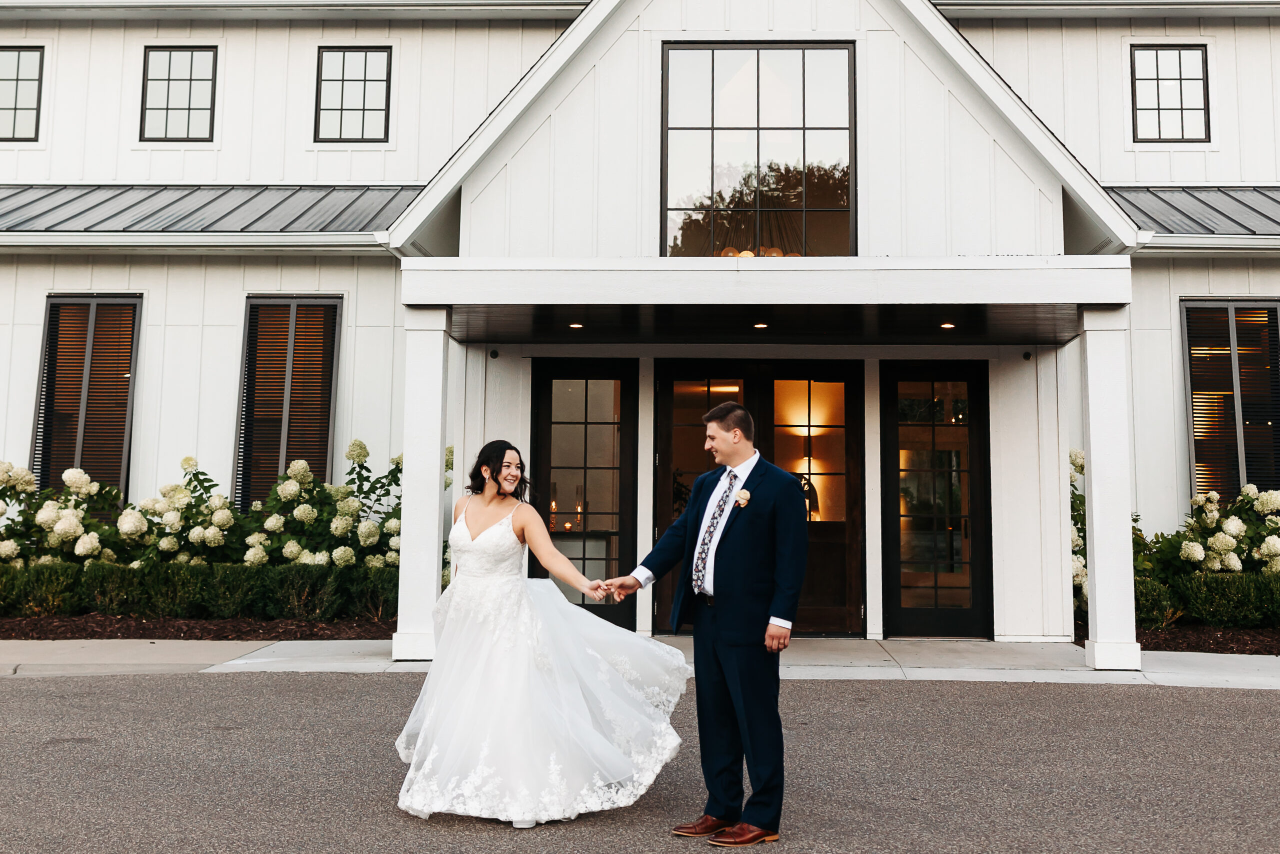 bride and groom dancing in front of The Hutton House